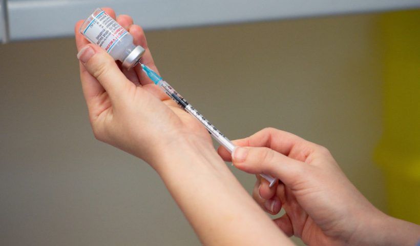 CARMARTHEN, WALES - APRIL 07: A nurse prepares the Moderna Covid-19 vaccine, at the West Wales General Hospital in Carmarthen, on April 7, 2021 in Carmarthen, Wales. Moderna, the third vaccine to be approved for use in the UK, is to be given to patients in Wales from Wednesday. Five thousand doses of the vaccine were sent to vaccination centres in the Hywel Dda University Health Board area on Tuesday. The vaccine's approval by the UK's Medicines and Healthcare products Regulatory Agency was announced on January 8. The UK has bought 17 million doses of the Moderna jab enough for 8.5 million people. (Photo by Jacob King - WPA Pool/Getty Images)
