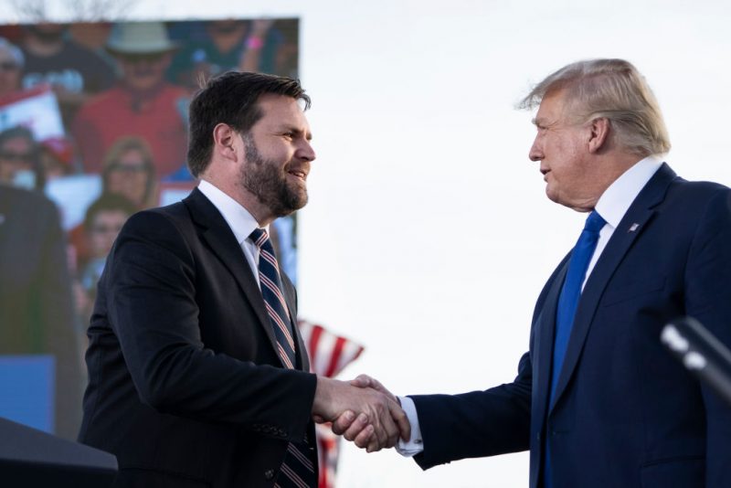 DELAWARE, OH - APRIL 23: (L-R) J.D. Vance, a Republican candidate for U.S. Senate in Ohio, shakes hands with former President Donald Trump during a rally hosted by the former president at the Delaware County Fairgrounds on April 23, 2022 in Delaware, Ohio. Last week, Trump announced his endorsement of J.D. Vance in the Ohio Republican Senate primary. (Photo by Drew Angerer/Getty Images)