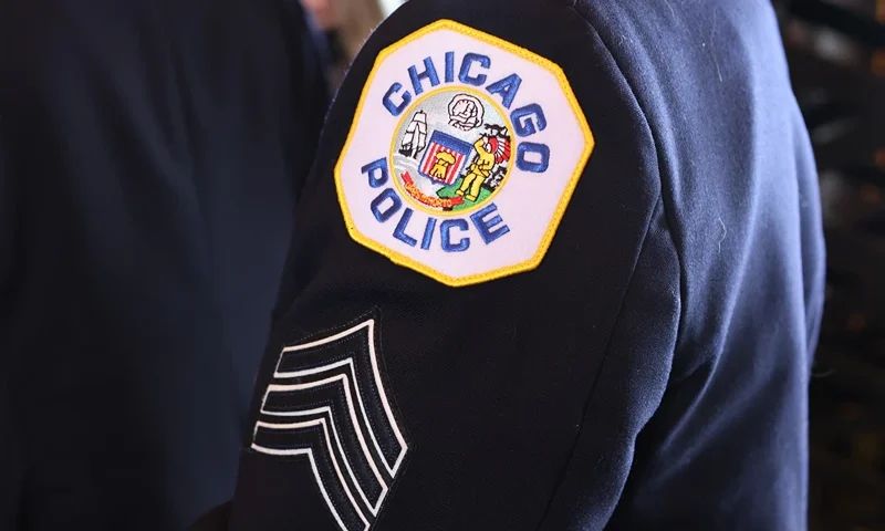 Chicago Graduates New Class Of Police Officers CHICAGO, ILLINOIS - OCTOBER 20: Police officers attend a Chicago Police Department promotion and graduation ceremony on October 20, 2021 in Chicago, Illinois. The city of Chicago has started to place police officers on unpaid leave for refusing to comply with the city's requirements that they report their COVID-19 vaccination status. Only about 65 percent of the city's police have complied with the order. (Photo by Scott Olson/Getty Images)
