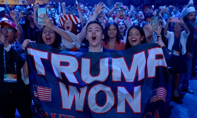 TAMPA, FLORIDA - JULY 23: People cheer as former U.S. President Donald Trump arrives on stage during the Turning Point USA Student Action Summit held at the Tampa Convention Center on July 23, 2022 in Tampa, Florida. The event features student activism, leadership training, and a chance to participate in networking events with political leaders. (Photo by Joe Raedle/Getty Images)