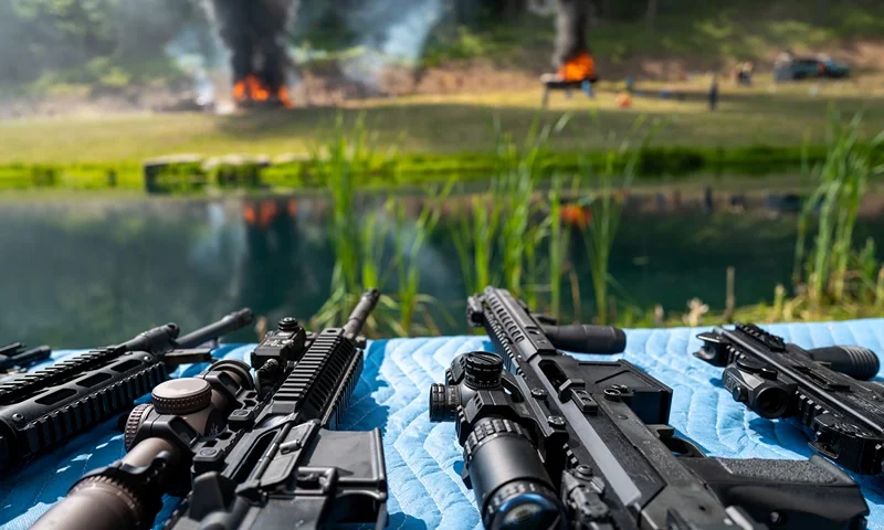MONROE, PENNSYLVANIA - JUNE 03: Guns are displayed as gun enthusiasts attend the annual Machine Gun Shoot sponsored by Shooters Gauntlet on June 03, 2023 in Monroe, Pennsylvania. The shoot, which has been held since 2016, lets members of the public and others shoot machine guns at targets in a controlled and secure wooded location. The two-day event features raffles, workshops, vendors and opportunities to rent and fire a variety of weapons. According to recent data, in 2021 Americans bought an estimated 19 million guns. (Photo by Spencer Platt/Getty Images)