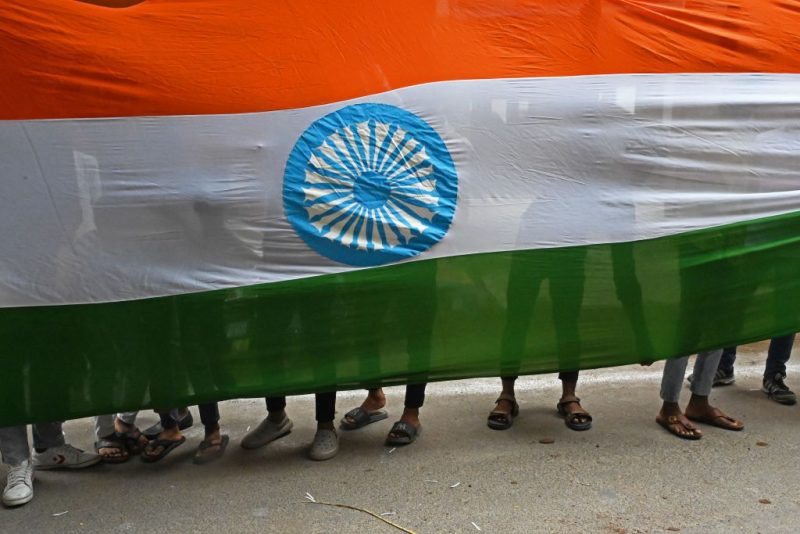 Supporters of Bharatiya Janata Party (BJP) carry a giant Indian national flag on the eve of country's Independence Day in Hyderabad on August 14, 2023. (Photo by Noah SEELAM / AFP) (Photo by NOAH SEELAM/AFP via Getty Images)