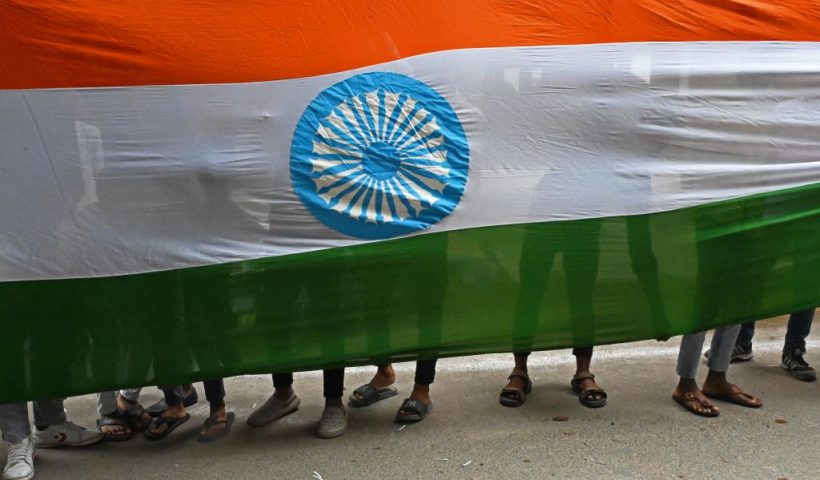 Supporters of Bharatiya Janata Party (BJP) carry a giant Indian national flag on the eve of country's Independence Day in Hyderabad on August 14, 2023. (Photo by Noah SEELAM / AFP) (Photo by NOAH SEELAM/AFP via Getty Images)