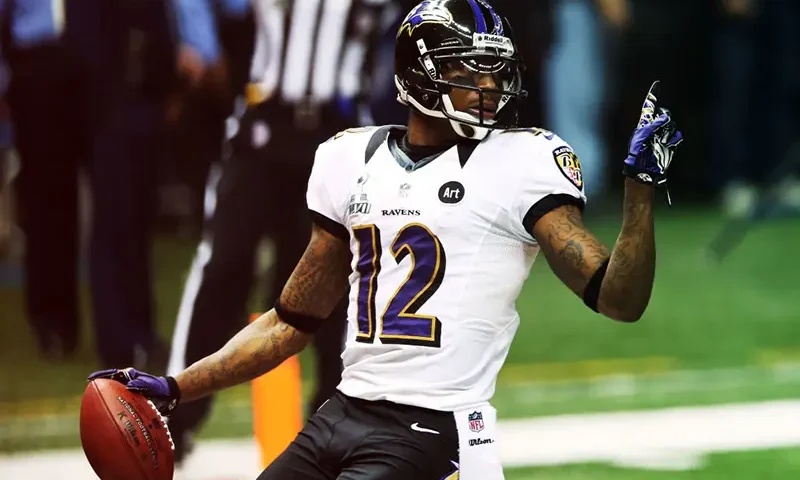 NEW ORLEANS, LA - FEBRUARY 03: Jacoby Jones #12 of the Baltimore Ravens reacts after he scored on a 108-yard kick-off return for a touchdown to open the second half against the San Francisco 49ers during Super Bowl XLVII at the Mercedes-Benz Superdome on February 3, 2013 in New Orleans, Louisiana. (Photo by Ronald Martinez/Getty Images)
