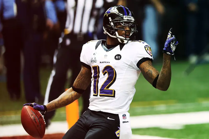NEW ORLEANS, LA - FEBRUARY 03: Jacoby Jones #12 of the Baltimore Ravens reacts after he scored on a 108-yard kick-off return for a touchdown to open the second half against the San Francisco 49ers during Super Bowl XLVII at the Mercedes-Benz Superdome on February 3, 2013 in New Orleans, Louisiana. (Photo by Ronald Martinez/Getty Images)