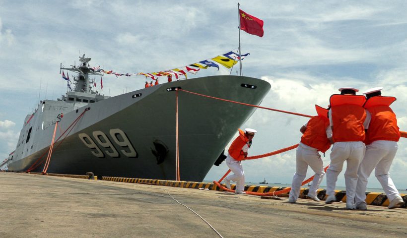 Chinese navy personnel pull a rope to dock Chinese amphibious warfare ship Jinggangshan during a welcome ceremony at the Sihanoukville port in Preah Sihanouk province on May 19, 2024. Two Chinese warships docked in Cambodia on May 19, 2024 as part of the biggest-ever joint military drills with the Southeast Asian nation. (Photo by AFP) (Photo by STR/AFP via Getty Images)