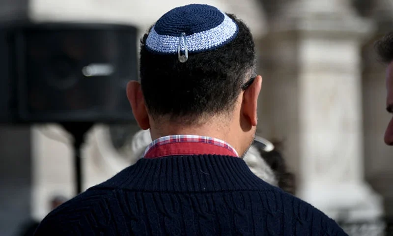 A man is wearing a kippah during a rally to condemn the alleged anti semetic gang rape of a 12 year old girl, during a rally, in Paris on June 19, 2024, following the indictment of two 13 year olds for gang rape, death threats, anti Semitic insults and violence against a 12 year old Jewish girl in Courbevoie. (Photo by Magali Cohen / Hans Lucas / Hans Lucas via AFP) (Photo by MAGALI COHEN/Hans Lucas/AFP via Getty Images)