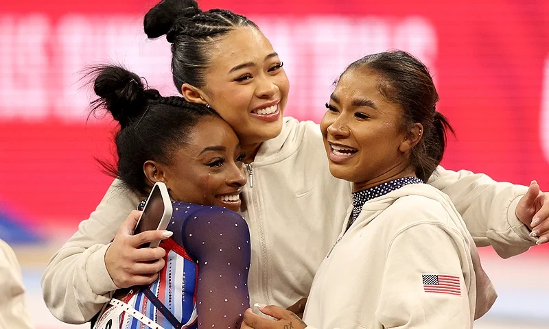 MINNEAPOLIS, MINNESOTA - JUNE 30: (L-R) Simone Biles, Suni Lee and Jordan Chiles react after competing on Day Four of the 2024 U.S. Olympic Team Gymnastics Trials at Target Center on June 30, 2024 in Minneapolis, Minnesota. (Photo by Elsa/Getty Images)