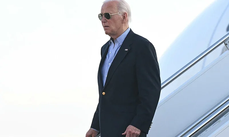 US President Joe Biden disembarks from Air Force One upon arrival at Delaware Air National Guard Base in New Castle, Delaware, July 5, 2024, as he travels to his home in Wilmington, Delaware. (Photo by SAUL LOEB / AFP) (Photo by SAUL LOEB/AFP via Getty Images)
