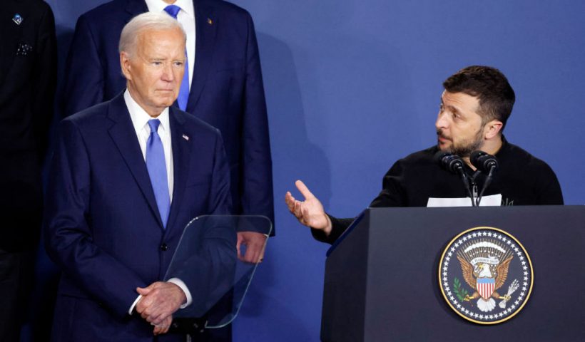 Ukraine's President Volodymyr Zelensky speaks alongside US President Joe Biden during a Ukraine Compact initiative on the sidelines of the NATO Summit at the Walter E. Washington Convention Center in Washington, DC, on July 11, 2024. (Photo by Ludovic MARIN / AFP) (Photo by LUDOVIC MARIN/AFP via Getty Images)