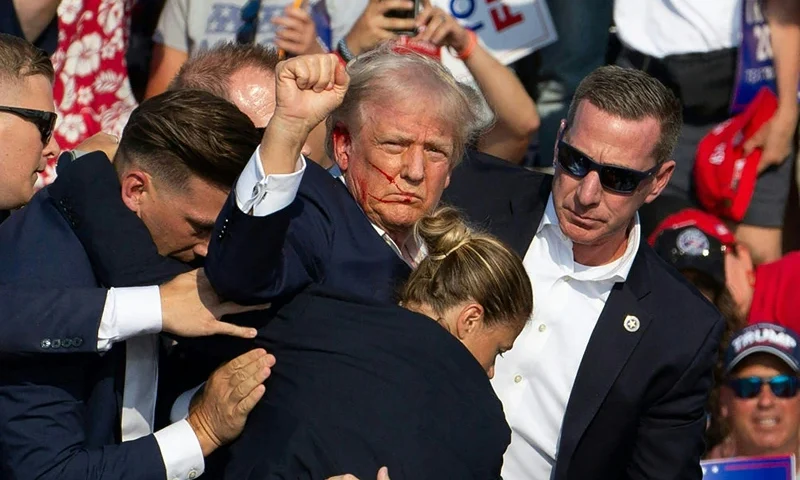 BUTLER, PENNSYLVANIA - JULY 13: Republican presidential candidate, former U.S. President Donald Trump arrives for a rally at Butler Farm Show Inc. on July 13, 2024 in Butler, Pennsylvania. Shortly after, shots rang out and Trump slumped before being whisked away by Secret Service with injuries visible to the side of his head. Butler County district attorney Richard Goldinger said the shooter and one audience member are dead and another was injured. (Photo by Jeff Swensen/Getty Images)