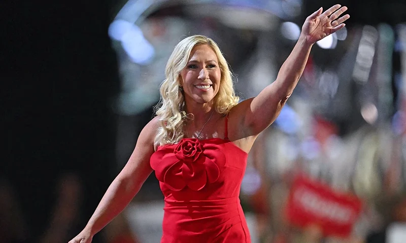 US Representative of Georgia Marjorie Taylor Green waves after speaking during the first day of the 2024 Republican National Convention at the Fiserv Forum in Milwaukee, Wisconsin, July 15, 2024. Days after he survived an assassination attempt, Republicans are set to nominate Donald Trump as the party's official presidential candidate at the Republican National Convention taking place in Milwaukee, Wisconsin, from July 15 to 18. (Photo by ANGELA WEISS / AFP) (Photo by ANGELA WEISS/AFP via Getty Images)