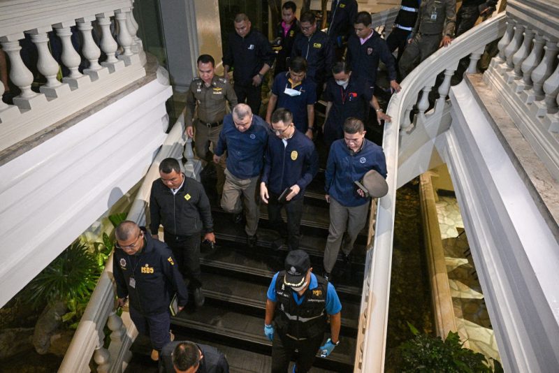 Policemen inspect after an incident, in which six bodies were found at a hotel in Bangkok on July 16, 2024. Six people believed to be Vietnamese and Vietnamese-Americans were found dead in a hotel room in central Bangkok on July 16, a senior police officer said. (Photo by Lillian SUWANRUMPHA / AFP) (Photo by LILLIAN SUWANRUMPHA/AFP via Getty Images)