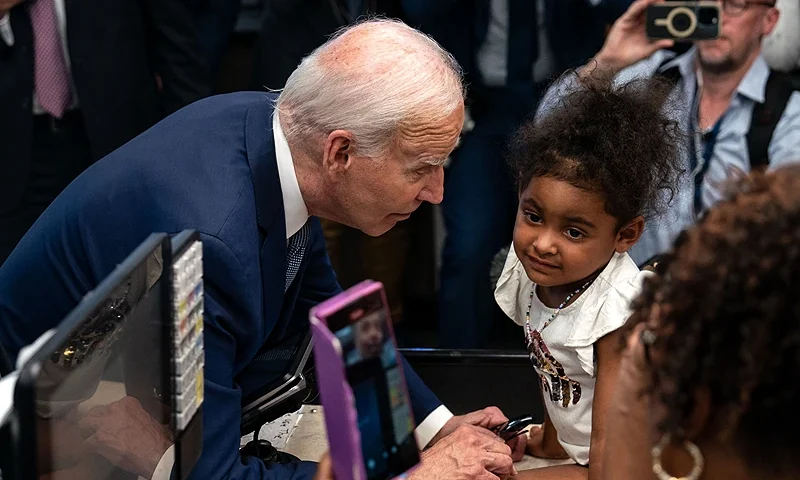US President Joe Biden (C-L) greets a young girl during a visit to Mario's Westside Market grocery store, alongside US Representative Steven Horsford (D-NV) (L), in Las Vegas, Nevada, on July 16, 2024. (Photo by Kent Nishimura / AFP) (Photo by KENT NISHIMURA/AFP via Getty Images)