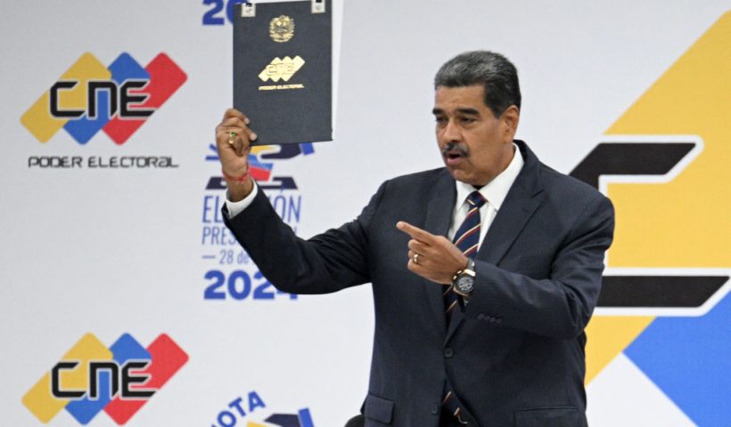 Venezuelan President Nicolas Maduro speaks next to the president of the National Electoral Council (CNE), Elvis Amoroso (out of frame), during his proclamation at the CNE headquarters in Caracas on July 29, 2024, a day after the Venezuelan presidential election. President Nicolas Maduro was declared the winner of Venezuela's presidential election but the opposition and key regional neighbours immediately rejected the official results. (Photo by Federico PARRA / AFP) (Photo by FEDERICO PARRA/AFP via Getty Images)