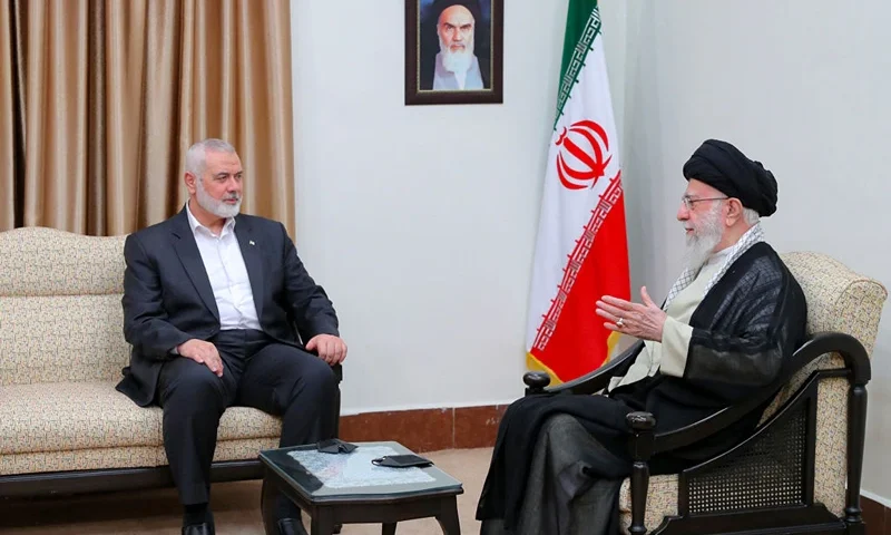 A handout picture provided by the office of Iran's Supreme Leader Ayatollah Ali Khamenei shows him (R) meeting with Palestinian Hamas movement leader Ismail Haniyeh in Tehran on July 30, 2024. (Photo by KHAMENEI.IR / AFP) / RESTRICTED TO EDITORIAL USE - MANDATORY CREDIT "AFP PHOTO /KHAMENEI.IR" - NO MARKETING NO ADVERTISING CAMPAIGNS - DISTRIBUTED AS A SERVICE TO CLIENTS (Photo by -/KHAMENEI.IR/AFP via Getty Images)