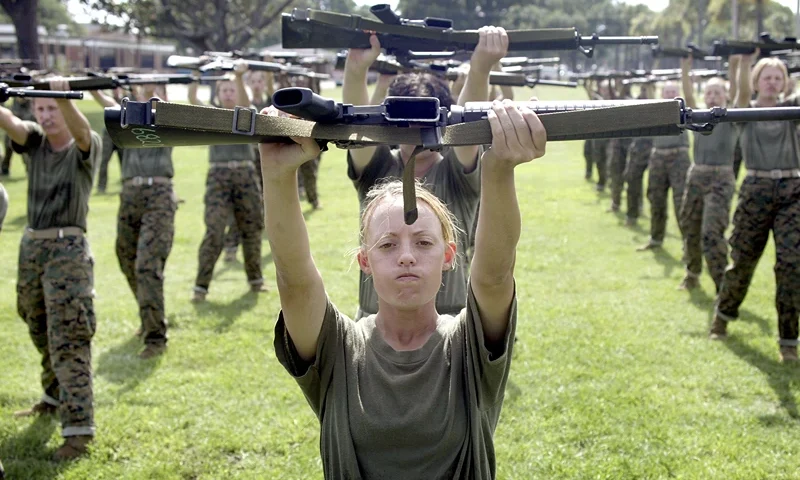 PARRIS ISLAND, SC - JUNE 23: Female Marine Corps recruit Kylieanne Fortin, 20, of Williamsport, Maryland goes through close combat training at the United States Marine Corps recruit depot June 23, 2004 in Parris Island, South Carolina. Marine Corps boot camp, with its combination of strict discipline and exhaustive physical training, is considered the most rigorous of the armed forces recruit training. Congress is currently considering bills that could increase the size of the Marine Corps and the Army to help meet US military demands in Iraq and Afghanistan. (Photo by Scott Olson/Getty Images)