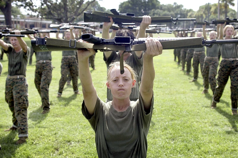 PARRIS ISLAND, SC - JUNE 23: Female Marine Corps recruit Kylieanne Fortin, 20, of Williamsport, Maryland goes through close combat training at the United States Marine Corps recruit depot June 23, 2004 in Parris Island, South Carolina. Marine Corps boot camp, with its combination of strict discipline and exhaustive physical training, is considered the most rigorous of the armed forces recruit training. Congress is currently considering bills that could increase the size of the Marine Corps and the Army to help meet US military demands in Iraq and Afghanistan. (Photo by Scott Olson/Getty Images)