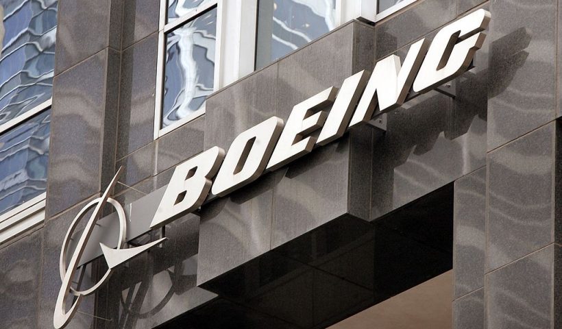 CHICAGO - NOVEMBER 28: The Boeing logo hangs on the corporate world headquarters building of Boeing November 28, 2006 in Chicago, Illinois. Orders for U.S. manufactured durable goods saw an 8.3 percent decrease in October. Aircraft orders dropped 45 percent for the same period. (Photo by Scott Olson/Getty Images)