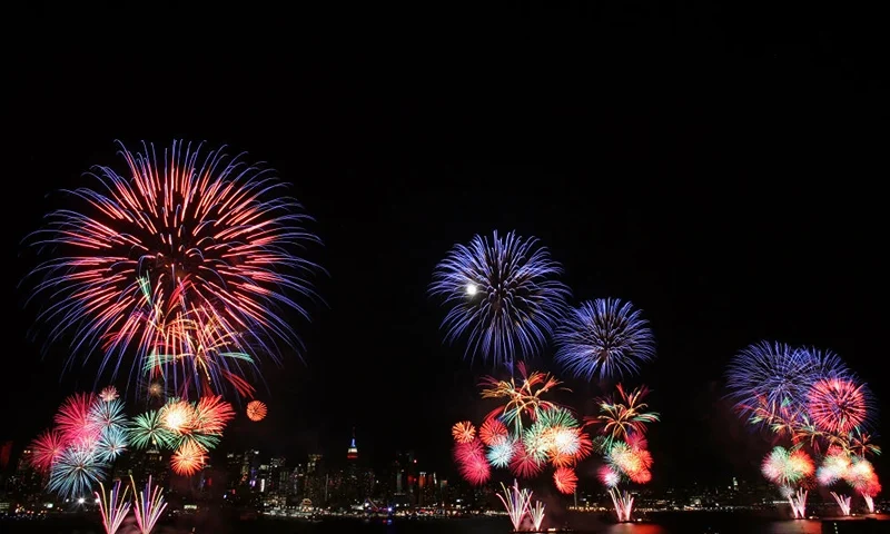 WEEHAWKEN, NJ. - JULY 4: The New York City skyline is seen in the distance as fireworks explode over the Hudson River during the Macy's fireworks display July 4, 2009 in Weehawken, New Jersey. It was the first time since 2000 that the Macy's display took place over the Hudson River and not the East River. (Photo by Yana Paskova/Getty Images)