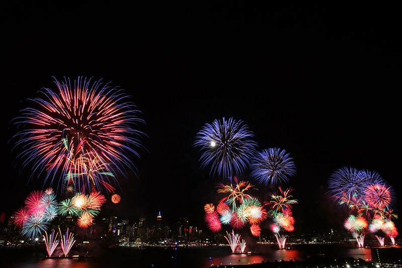 WEEHAWKEN, NJ. - JULY 4: The New York City skyline is seen in the distance as fireworks explode over the Hudson River during the Macy's fireworks display July 4, 2009 in Weehawken, New Jersey. It was the first time since 2000 that the Macy's display took place over the Hudson River and not the East River. (Photo by Yana Paskova/Getty Images)