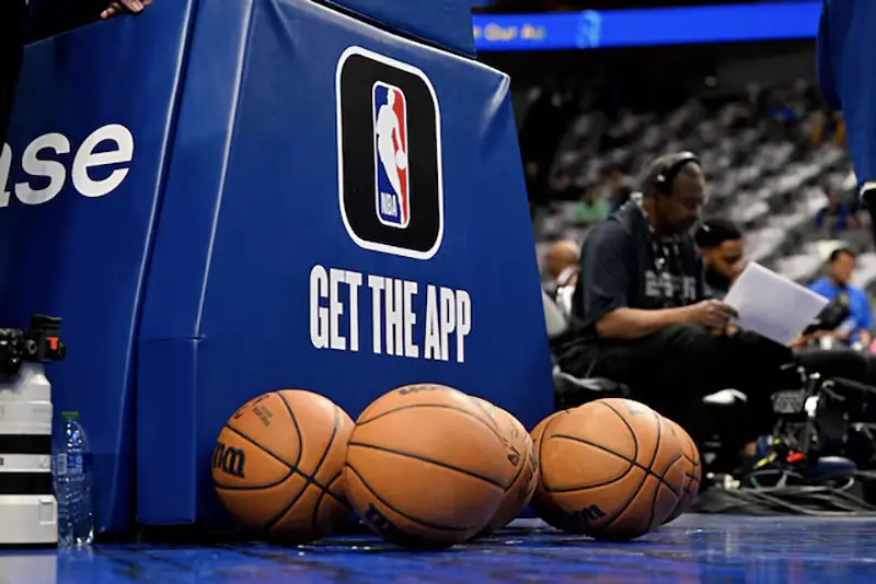A view of the NBA logo and basketballs during warms up before the game between the Dallas Mavericks and the Suns at the American Airlines Center. /Jerome Miron-USA TODAY Sports/File Photo