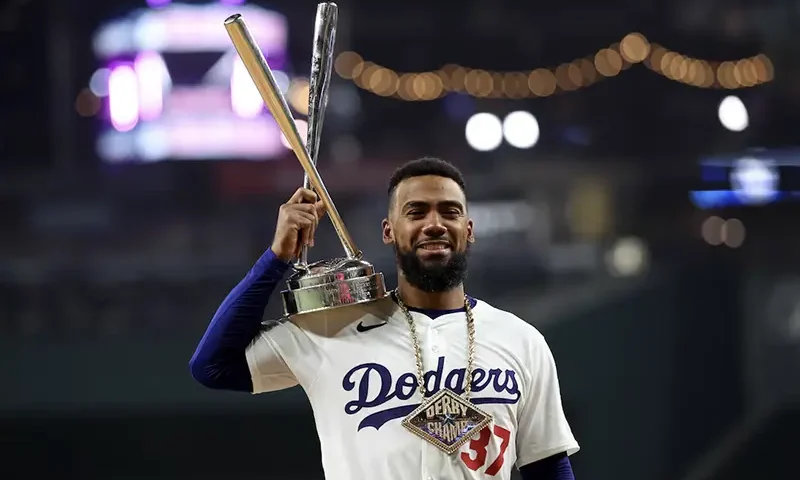 National League outfielder Teoscar Hernandez of the Los Angeles Dodgers (37) poses with the trophy after winning the 2024 Home Run Derby at Globe Life Field. Mandatory Credit: Kevin Jairaj-USA TODAY Sports