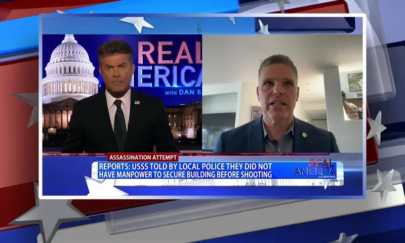 Video still from Real America on One America News Network showing a split screen of the host on the left side, and on the right side is the guest, Jim Hellmold.