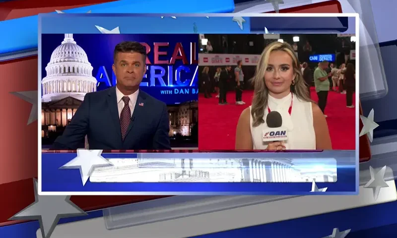 Video still from Real America on One America News Network showing a split screen of the host on the left side, and on the right side is the guest, Monica Paige.