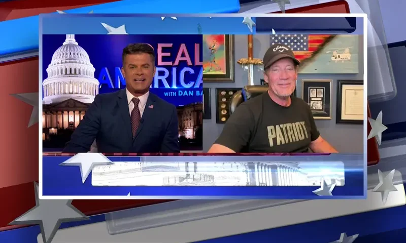 Video still from Real America on One America News Network showing a split screen of the host on the left side, and on the right side is the guest, Kevin Sorbo.