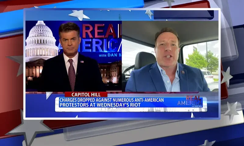 Video still from Real America on One America News Network showing a split screen of the host on the left side, and on the right side is the guest, Rep. Pat Fallon.