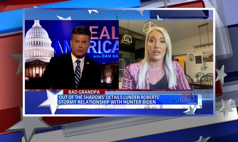 Video still from Real America on One America News Network showing a split screen of the host on the left side, and on the right side is the guest, Lunden Roberts.