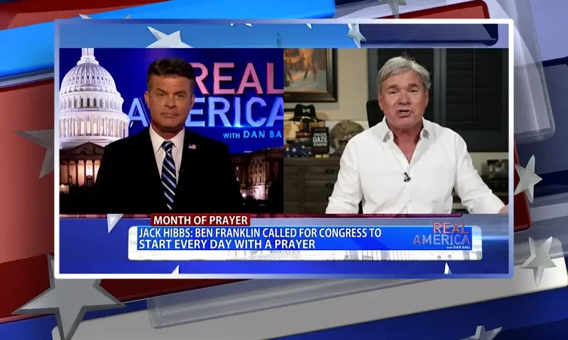 Video still from Real America on One America News Network showing a split screen of the host on the left side, and on the right side is the guest, Jack Hibbs.