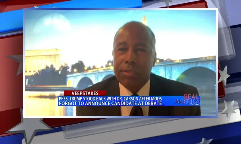 Video still from Real America on One America News Network during an interview with the guest, Dr. Ben Carson.