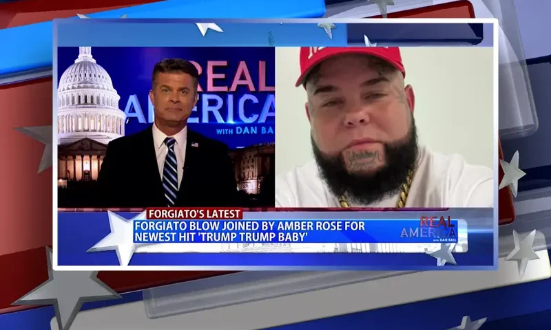 Video still from Real America on One America News Network showing a split screen of the host on the left side, and on the right side is the guest, Forgiato Blow.