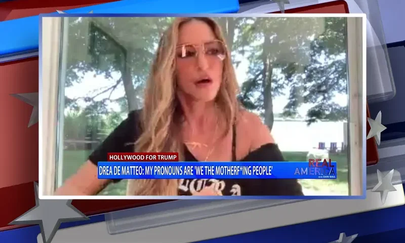 Video still from Real America on One America News Network during an interview with the guest, Drea de Matteo.