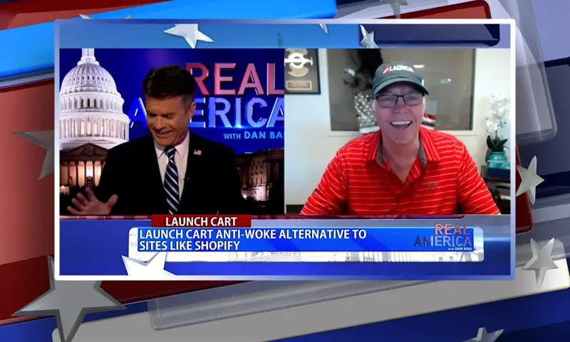 Video still from Real America on One America News Network showing a split screen of the host on the left side, and on the right side is the guest, Greg Writer.
