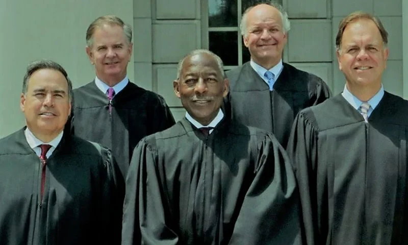 Pictured, in front row (L-R), are Justice John W. Kittredge, Chief Justice Donald W. Beatty, and Justice John Cannon Few, and in back row (L-R), Justices George C. James, Jr. and D. Garrison Hill. (Photo via: The Riley Institute)