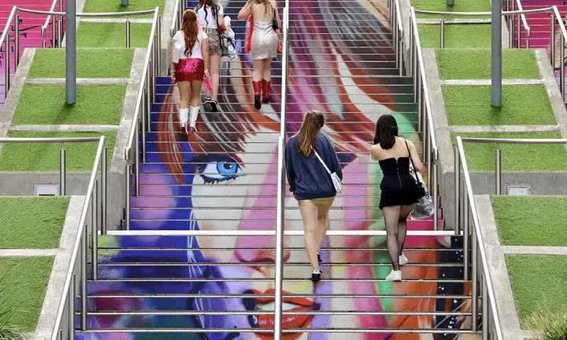 People walk on the 'Swiftie Steps' ahead of a Taylor Swift concert, following the cancellation of three Taylor Swift concerts in Vienna because of a planned attack, at Wembley Stadium in London, Britain, August 15, 2024. REUTERS/Toby Melville/File Photo