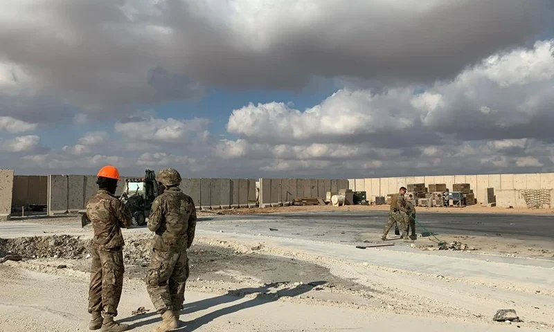 A picture taken on January 13, 2020 during a press tour organised by the US-led coalition fighting the remnants of the Islamic State group, shows US soldiers clearing rubble at Ain al-Asad military airbase in the western Iraqi province of Anbar. - Iran last week launched a wave of missiles at the sprawling Ain al-Asad airbase in western Iraq and a base in Arbil, capital of Iraq's autonomous Kurdish region, both hosting US and other foreign troops, in retaliation for the US killing top Iranian general Qasem Soleimani in a drone strike in Baghdad on January 3. (Photo by Ayman HENNA / AFP) (Photo by AYMAN HENNA/AFP via Getty Images)