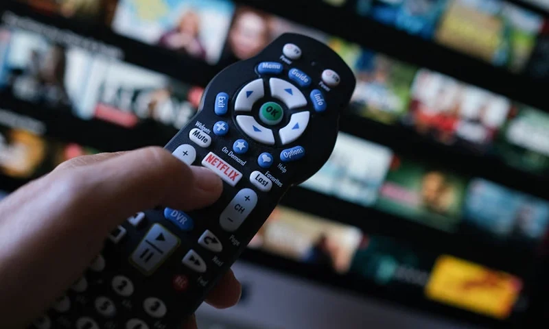 In this illustration photo taken on July 19, 2022 the Netflix logo is seen on a TV remote in Los Angeles. Netflix reported losing subscribers for the second quarter in a row Tuesday as the streaming giant battles fierce competition and viewer belt tightening, but the company assured investors of better days ahead. The loss of 970,000 paying customers in the most recent quarter was not as big as expected, and left Netflix with just shy of 221 million subscribers. (Photo by Chris DELMAS / AFP) (Photo by CHRIS DELMAS/AFP via Getty Images)