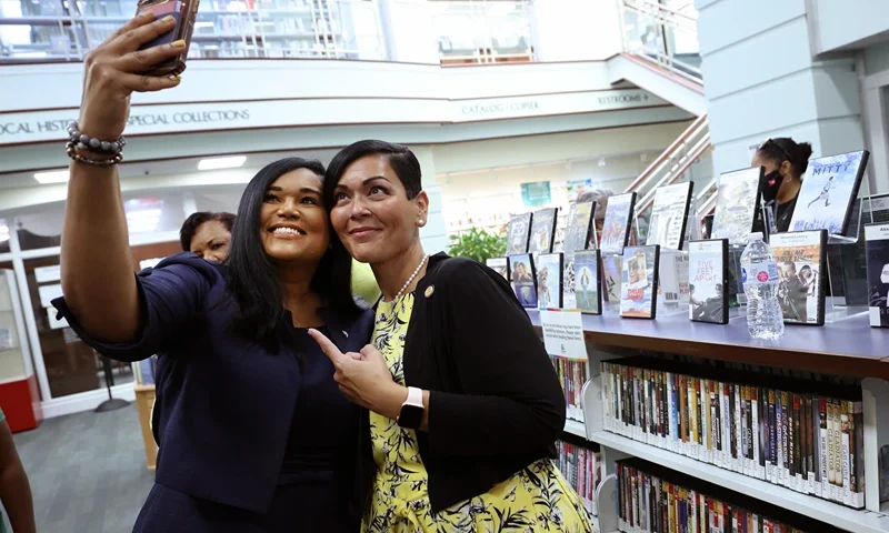 ALEXANDRIA, VIRGINIA - JULY 16: Texas State Rep. Shawn Thierry (D-146) (L) takes a photo with Hala Ayala, Democratic nominee for Virginia lieutenant governor, as they visit the Kate Waller Barrett Branch Library, the site of the 1939 Alexandria Library sit-in, where five Black men were arrested for attempting to register for a library card, on July 16, 2021 in Alexandria, Virginia. Members of Texas House Democratic Caucus continue to lobby for voting rights reform in Washington, DC after leaving Texas to block a voting restrictions bill by denying a Republican quorum. (Photo by Kevin Dietsch/Getty Images)