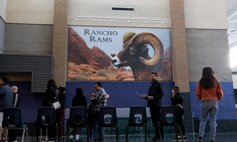LAS VEGAS, NEVADA - NOVEMBER 08: Voters wait in line to fill out their ballots at Rancho High School on November 08, 2022 in Las Vegas, Nevada. After months of candidates campaigning, Americans are voting in the midterm elections to decide close races across the nation. (Photo by Anna Moneymaker/Getty Images)