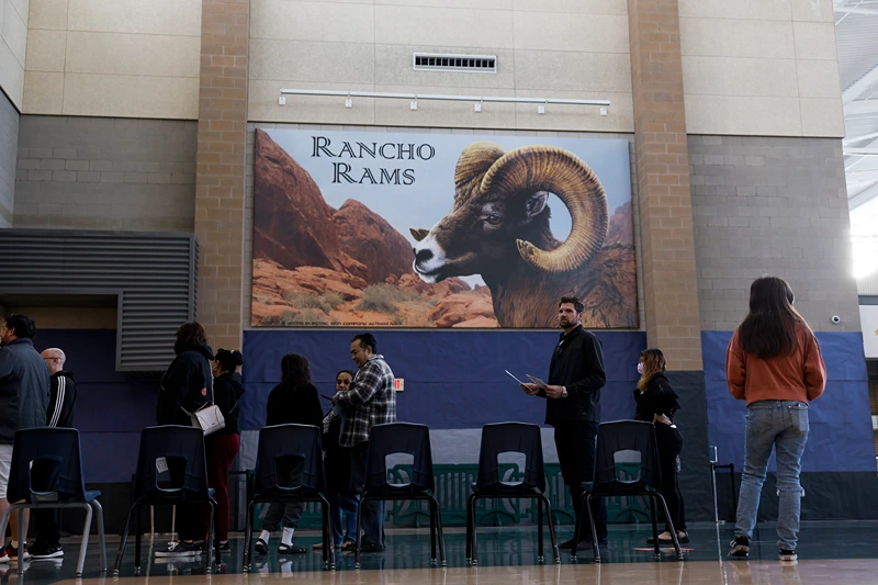 LAS VEGAS, NEVADA - NOVEMBER 08: Voters wait in line to fill out their ballots at Rancho High School on November 08, 2022 in Las Vegas, Nevada. After months of candidates campaigning, Americans are voting in the midterm elections to decide close races across the nation. (Photo by Anna Moneymaker/Getty Images)