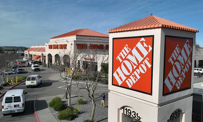 EL CERRITO, CALIFORNIA - FEBRUARY 21: In an aerial view, a sign is seen posted on the exterior of a Home Depot store on February 21, 2023 in El Cerrito, California. Home improvement retailer Home Depot announced plans to spend an estimated $1 billion to raise pay and benefits for hourly workers at its stores. (Photo by Justin Sullivan/Getty Images)