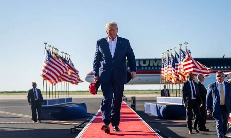 WACO, TEXAS - MARCH 25: Former U.S. President Donald Trump arrives during a rally at the Waco Regional Airport on March 25, 2023 in Waco, Texas. Former U.S. president Donald Trump attended and spoke at his first rally since announcing his 2024 presidential campaign. Today in Waco also marks the 30 year anniversary of the weeks deadly standoff involving Branch Davidians and federal law enforcement. 82 Davidians were killed, and four agents left dead. (Photo by Brandon Bell/Getty Images)