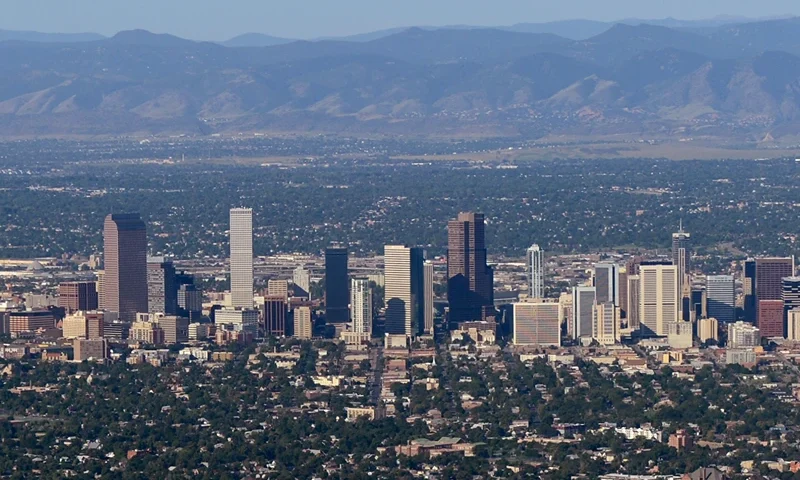 AURORA, CO - JULY 21: The downtown Denver skyline is seen from the air a day after a gunman went on a shooting rampage at the Century 16 movie theatre during an early morning screening of the new Batman movie, 'The Dark Knight Rises,' on July 21, 2012 in Aurora, Colorado. According to reports, 12 people have been killed and over 59 injured including 9 in critical condition . Police have the suspect, twenty-four year old James Holmes of North Aurora, in custody. (Photo by Kevork Djansezian/Getty Images)