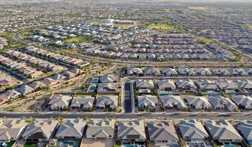 QUEEN CREEK, ARIZONA - JUNE 09: An aerial view of homes in the Phoenix suburbs on June 9, 2023 in Queen Creek, Arizona. Queen Creek is one of the fastest growing communities in Arizona and is heavily reliant on groundwater for its water supply. Arizona Governor Katie Hobbs announced last week that Arizona will no longer be able to give developers new permits for home construction in some outlying areas of Maricopa County which rely on groundwater wells, due to a groundwater shortage amid a warming climate. Queen Creek is already spending around $24 million in total to purchase 2,000 acre-feet of Colorado River water entitlement per year from the GSC Farm located nearly 200 miles to the west in Cibola, Arizona. (Photo by Mario Tama/Getty Images)