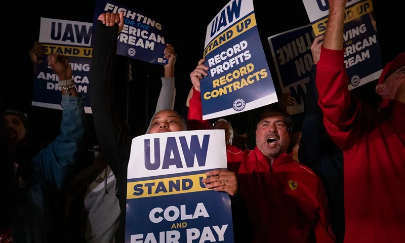 United Auto Workers Hold Limited Strikes As Contract Negotiations Expire WAYNE, MICHIGAN - SEPTEMBER 15: Supporters and workers cheer as United Auto Workers members go on strike at the Ford Michigan Assembly Plant on September 15, 2023 in Wayne, Michigan. Contract negotiations with the Big Three auto makers Ford, General Motors, and Stellantis expired at 11:59pm September 14. This is the first time in history that the UAW is striking all three of the Big Three auto makers at the same time. (Photo by Bill Pugliano/Getty Images)