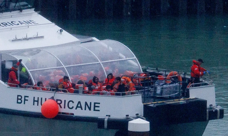 : Migrants are brought ashore after being picked up in the English Channel on November 16, 2023 in Dover, United Kingdom. Rishi Sunak has pledged to introduce emergency legislation and negotiate a new treaty with Rwanda, ensuring that individuals deported from the UK will not be returned to their home countries. The announcement was made in response to the Supreme Court's ruling that the government's controversial plan to fly asylum seekers arriving by small boats to Rwanda as illegal. The proposal, introduced by Boris Johnson in April 2022, aimed to deter migrants from crossing the English Channel. (Photo by Dan Kitwood/Getty Images)
